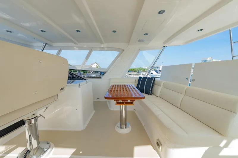 Slide: The Image of Luxurious interior of 2016 Grand Banks 72 Aleutian RP yacht with elegant seating and helm. - 32