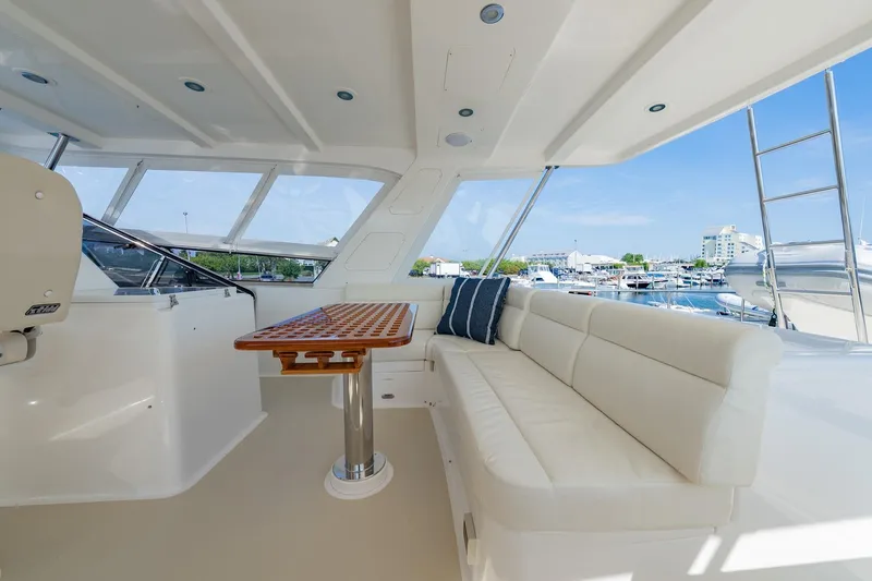 Slide: The Image of Luxurious interior of 2016 Grand Banks 72 Aleutian RP yacht with plush seating and table. - 34