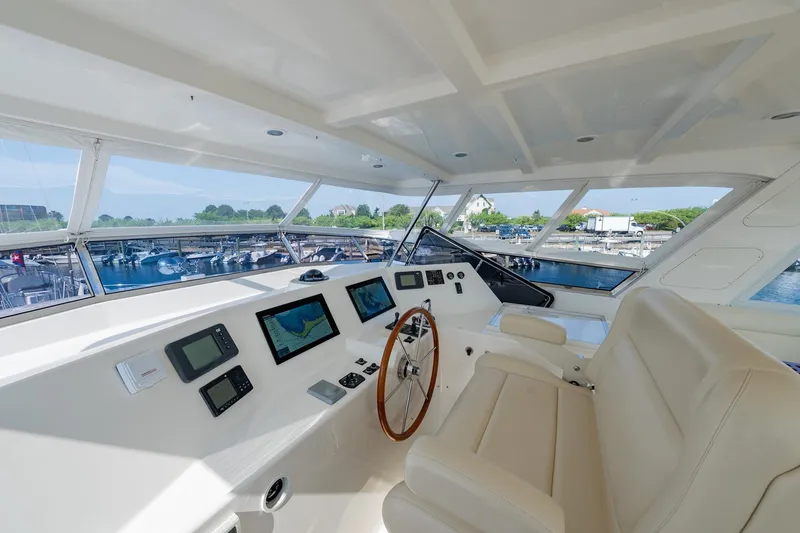 Slide: The Image of Helm of 2016 Grand Banks 72 Aleutian RP yacht with panoramic windows and modern controls. - 36