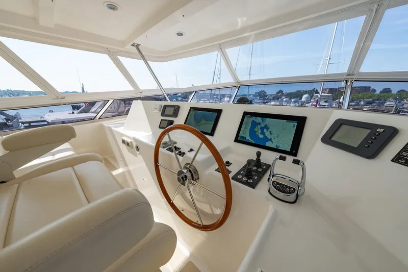 Slide: The Image of Helm of 2016 Grand Banks 72 Aleutian RP yacht with navigation screens and leather seating. - 37