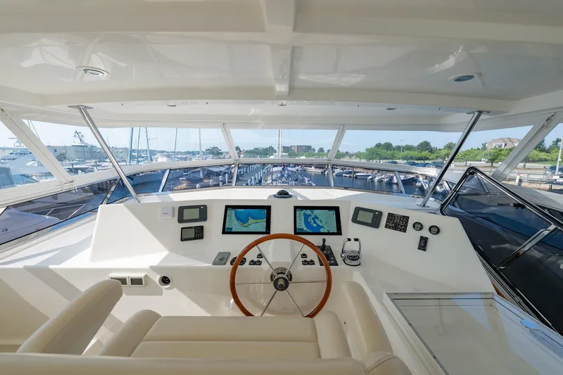 Slide: The Image of Helm of 2016 Grand Banks 72 Aleutian RP yacht with navigation screens and controls. - 38