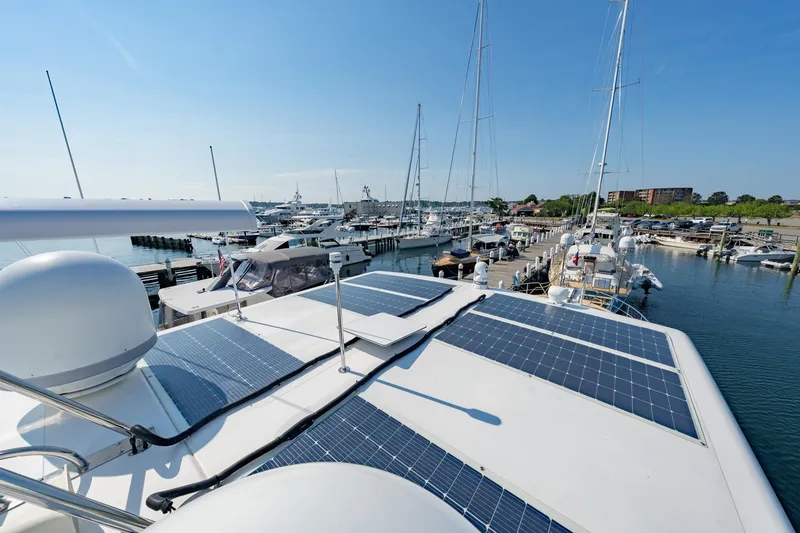 Slide: The Image of 2016 Grand Banks 72 Aleutian RP yacht with solar panels docked at marina. - 41