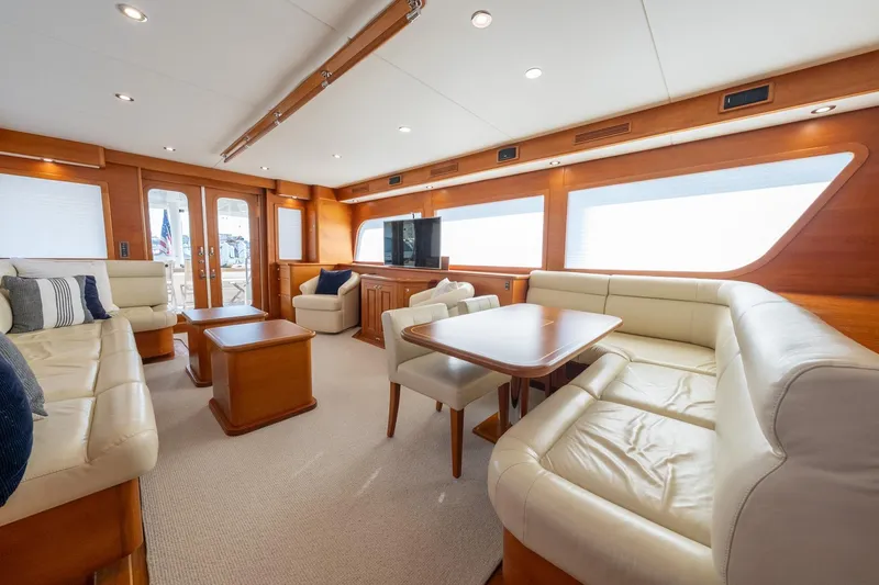 Slide: The Image of Luxurious interior of 2016 Grand Banks 72 Aleutian RP yacht with elegant seating and wood finishes. - 48