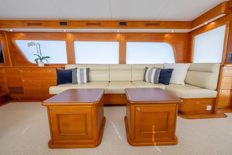 Slide: The Image of Luxurious interior of 2016 Grand Banks 72 Aleutian RP yacht with elegant seating and wooden accents. - 52