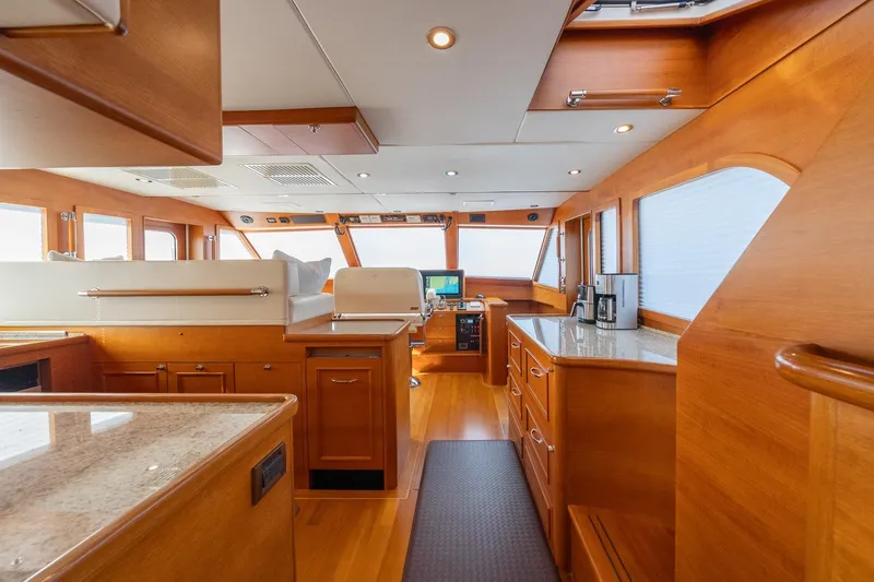 Slide: The Image of Luxurious interior of 2016 Grand Banks 72 Aleutian RP yacht with elegant seating and wooden accents. - 53