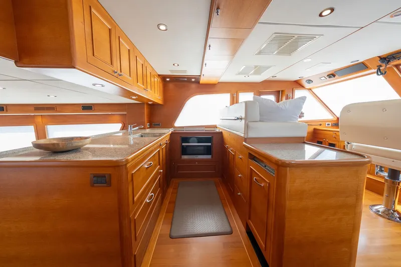 Slide: The Image of Luxurious interior of 2016 Grand Banks 72 Aleutian RP yacht with wooden finishes. - 54