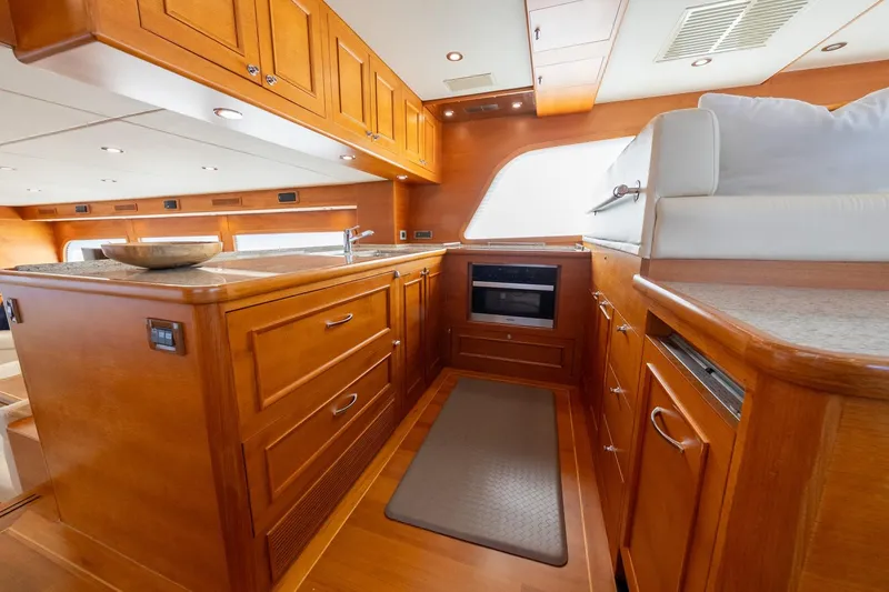 Slide: The Image of Luxurious 2016 Grand Banks 72 Aleutian RP yacht interior with elegant wood cabinetry and modern amenities. - 55