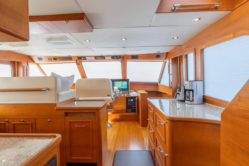 Slide: The Image of Luxurious kitchen interior of 2016 Grand Banks 72 Aleutian RP yacht with wooden cabinetry. - 56
