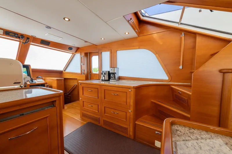 Slide: The Image of Interior of 2016 Grand Banks 72 Aleutian RP yacht with open wooden cabinet. - 58