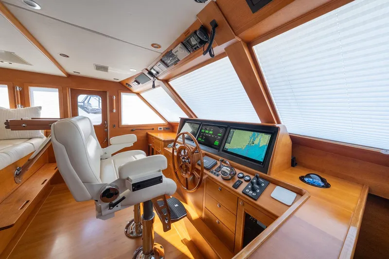Slide: The Image of Luxurious interior of 2016 Grand Banks 72 Aleutian RP yacht with plush seating and helm. - 68