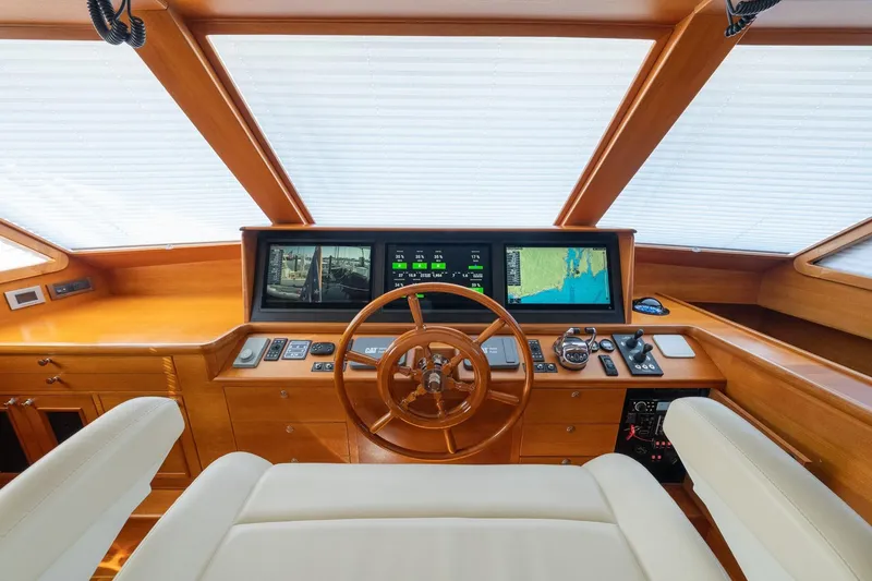Slide: The Image of Luxurious helm of 2016 Grand Banks 72 Aleutian RP with navigation screens and controls. - 71
