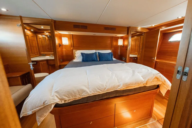 Slide: The Image of Luxurious 2016 Grand Banks 72 Aleutian RP yacht cabin with elegant wood interior. - 74
