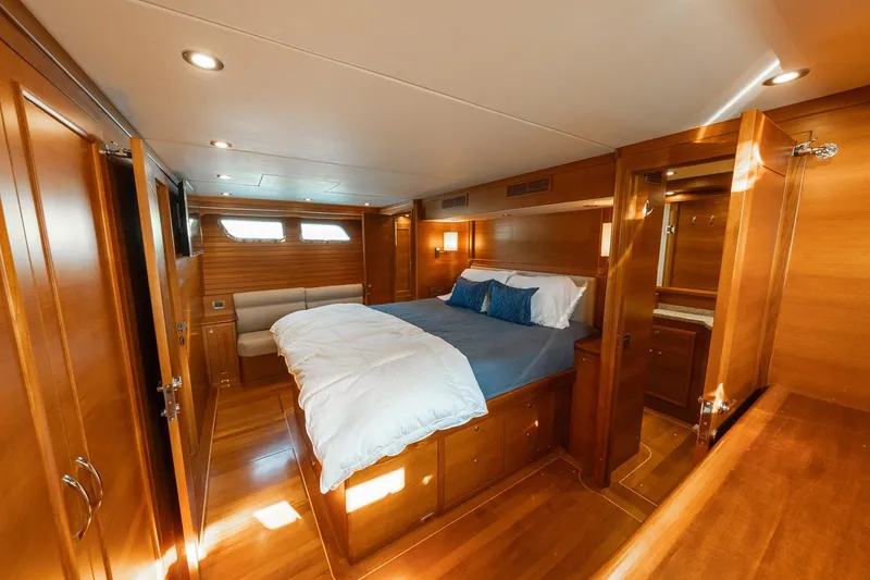 Slide: The Image of Luxurious cabin interior of 2016 Grand Banks 72 Aleutian RP yacht with wooden finishes. - 75