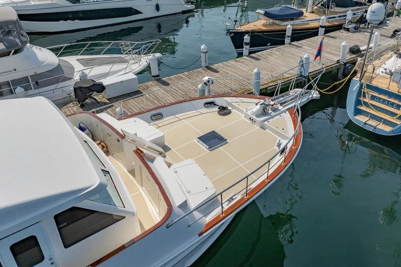 Slide: The Image of 2016 Grand Banks 72 Aleutian RP yacht docked with tender on deck. - 8
