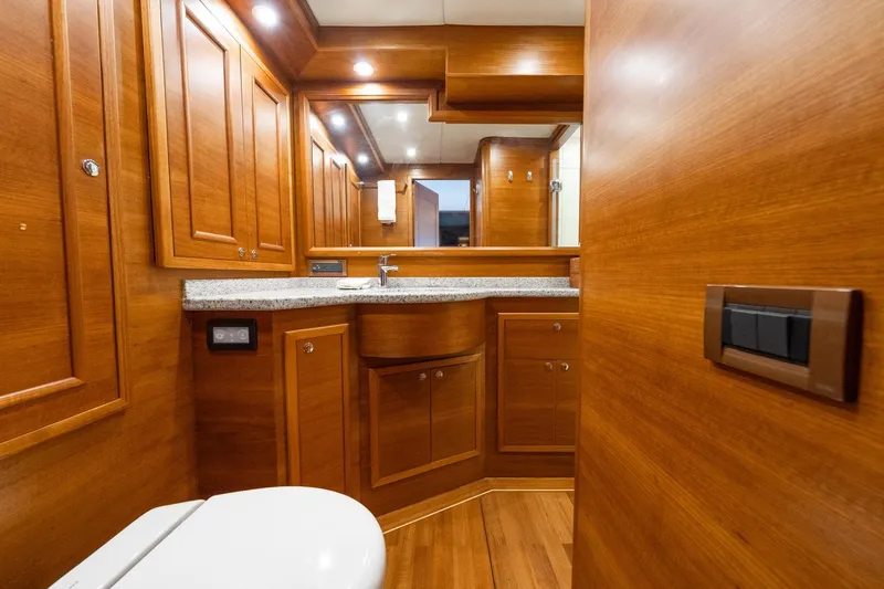 Slide: The Image of Luxurious wooden bathroom interior on 2016 Grand Banks 72 Aleutian RP yacht. - 81