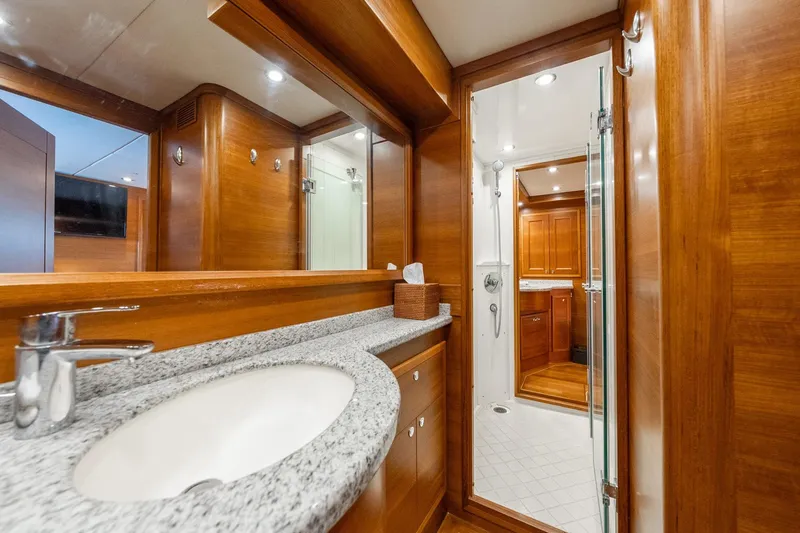 Slide: The Image of Luxurious bathroom interior of 2016 Grand Banks 72 Aleutian RP yacht with wooden accents. - 83