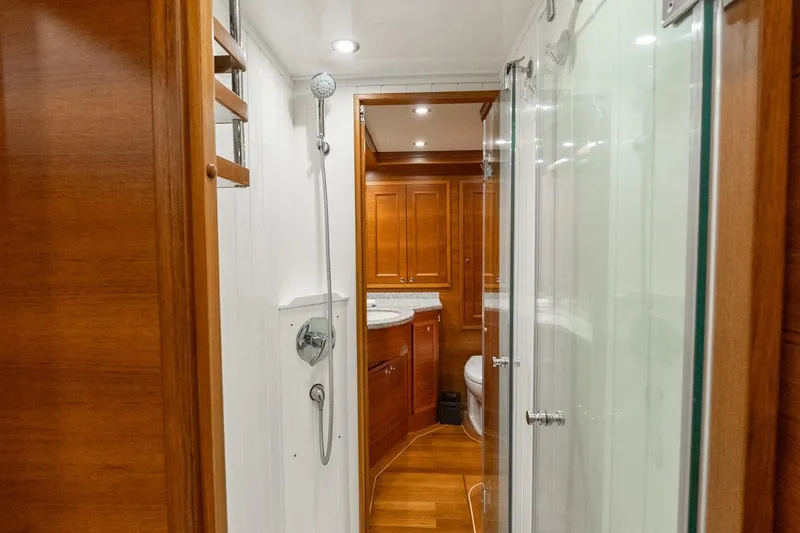 Slide: The Image of Luxurious bathroom interior on 2016 Grand Banks 72 Aleutian RP yacht, featuring wood finishes. - 84