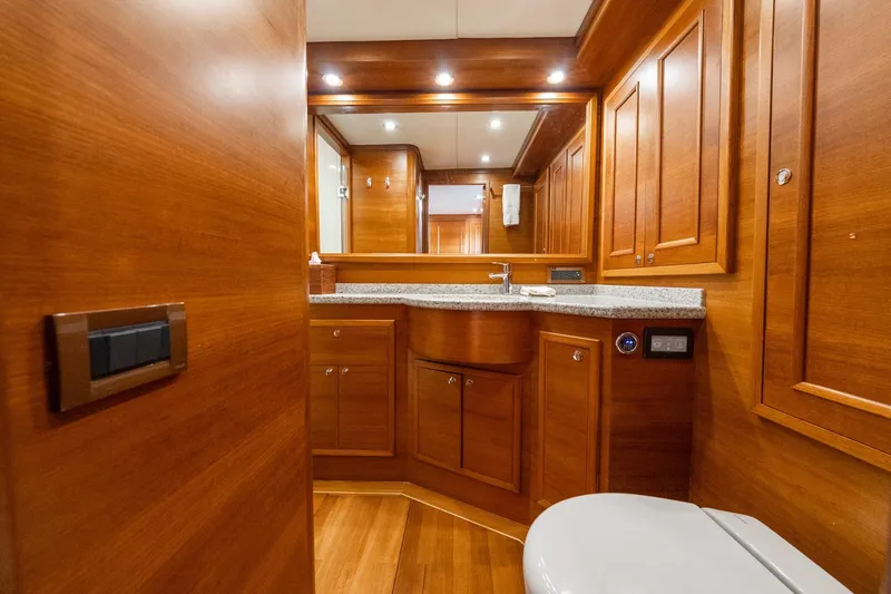Slide: The Image of Luxurious wooden bathroom interior on 2016 Grand Banks 72 Aleutian RP yacht. - 87