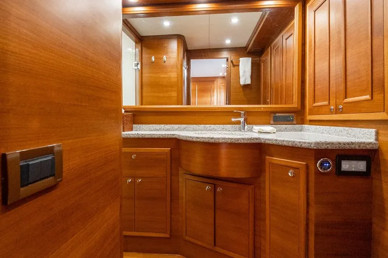 Slide: The Image of Luxurious wooden bathroom interior of 2016 Grand Banks 72 Aleutian RP yacht. - 88