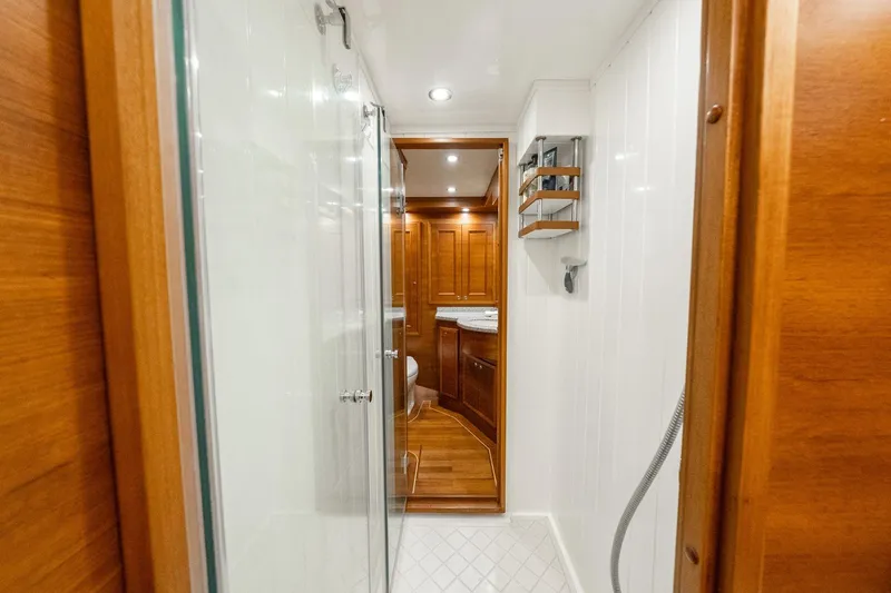 Slide: The Image of Luxurious bathroom interior of 2016 Grand Banks 72 Aleutian RP yacht with wooden cabinetry. - 90