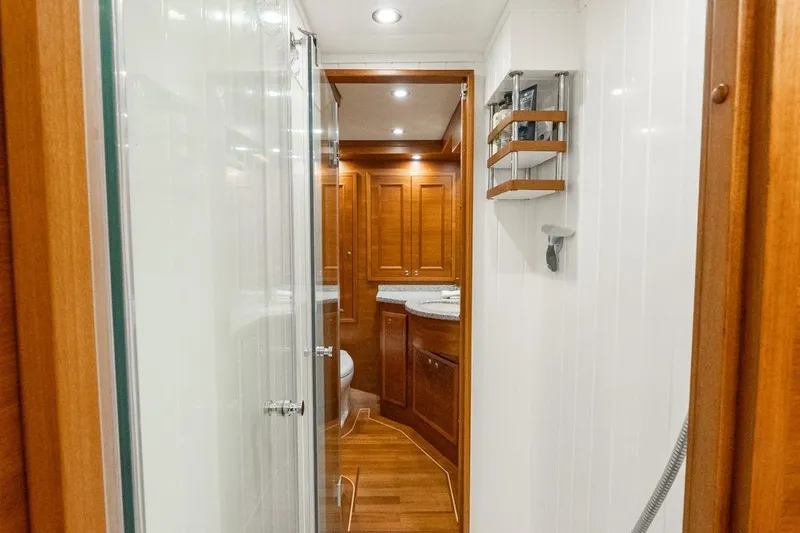 Slide: The Image of Luxurious bathroom interior of 2016 Grand Banks 72 Aleutian RP yacht with wooden accents. - 91