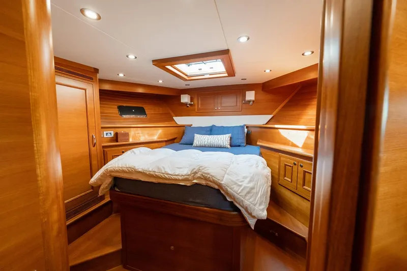 Slide: The Image of Luxurious wooden interior of 2016 Grand Banks 72 Aleutian RP yacht cabin. - 94