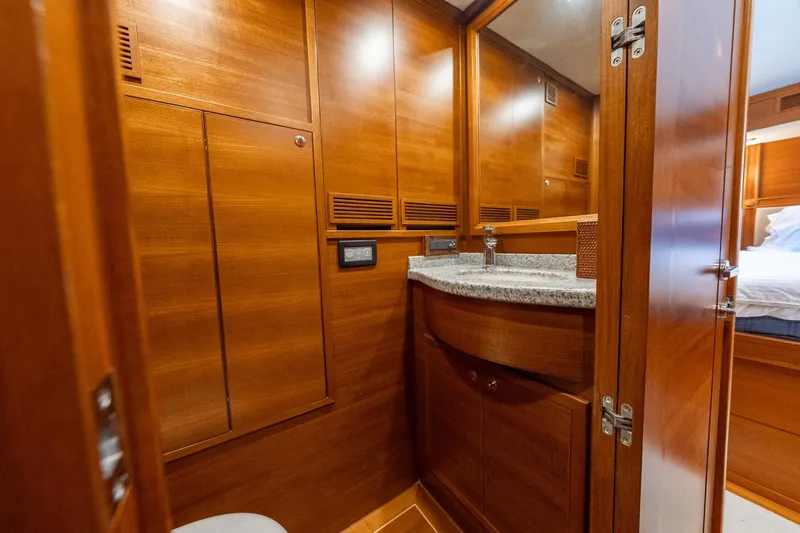 Slide: The Image of Luxurious wooden interior of 2016 Grand Banks 72 Aleutian RP yacht cabin. - 97