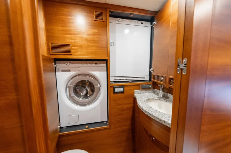 Slide: The Image of Luxurious wooden interior of 2016 Grand Banks 72 Aleutian RP yacht bathroom. - 99