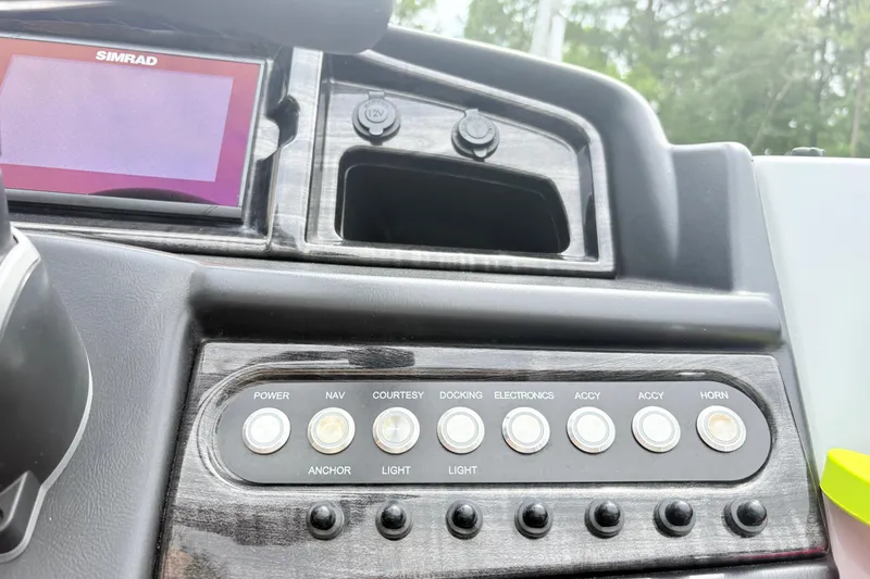 Slide: The Image of Dashboard of 2022 Bentley Pontoons 223 Elite with control panel and Simrad display. - 14