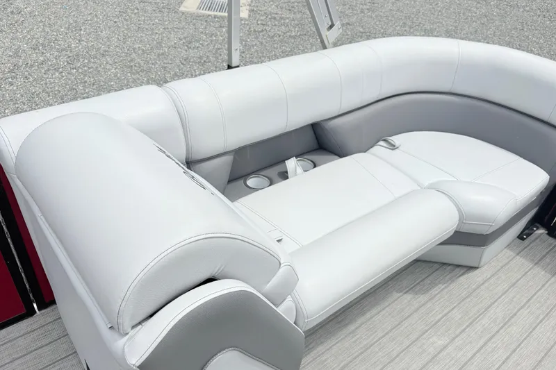 Slide: The Image of 2022 Bentley Pontoons 223 Elite interior with luxurious white seating and cup holders. - 16