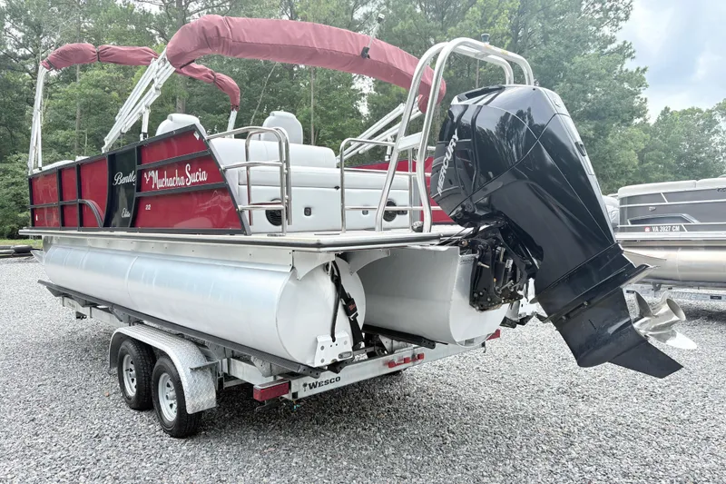 Slide: The Image of 2022 Bentley Pontoons 223 Elite on trailer, featuring a powerful Mercury outboard motor. - 4