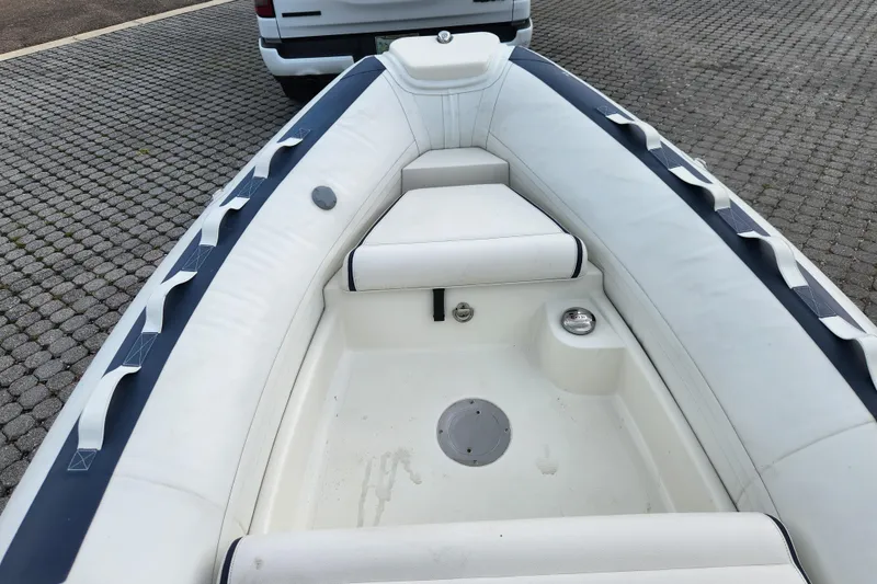 Slide: The Image of 2019 Novurania DL 400 inflatable boat interior with white seating and blue accents. - 15