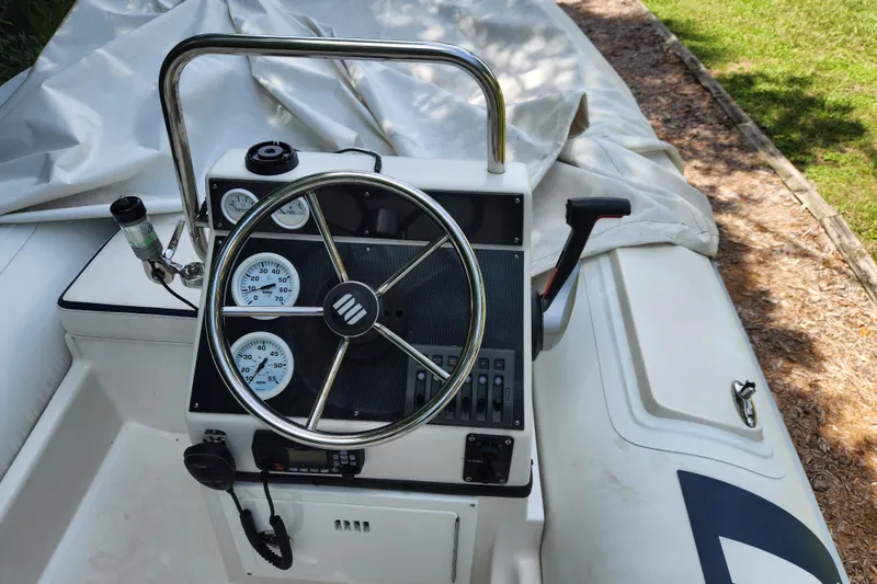 Slide: The Image of 2019 Novurania DL 400 boat console with steering wheel and gauges. - 17