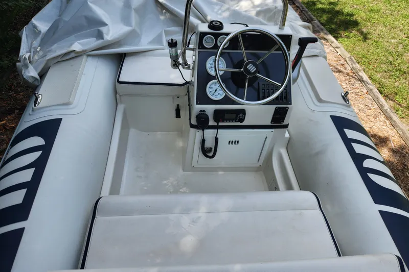 Slide: The Image of 2019 Novurania DL 400 inflatable boat interior with steering wheel and control panel. - 19