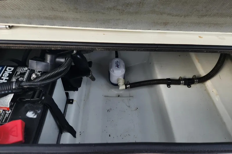 Slide: The Image of Battery compartment of 2019 Novurania DL 400 boat with wiring and pump. - 21