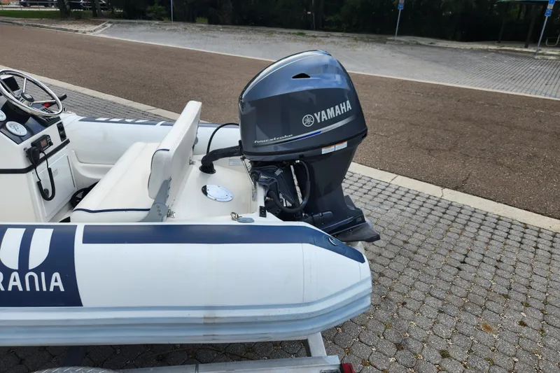 Slide: The Image of 2019 Novurania DL 400 boat with Yamaha outboard motor on a trailer. - 27