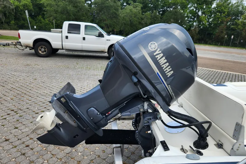 Slide: The Image of 2019 Novurania DL 400 with Yamaha outboard motor, parked near a white pickup truck. - 42