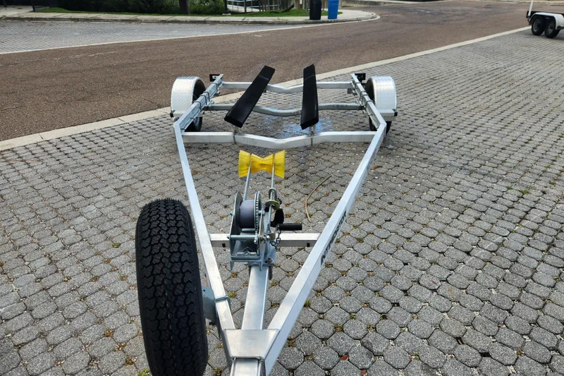 Slide: The Image of 2019 Novurania DL 400 boat trailer on paved surface, featuring sturdy frame and wheels. - 50