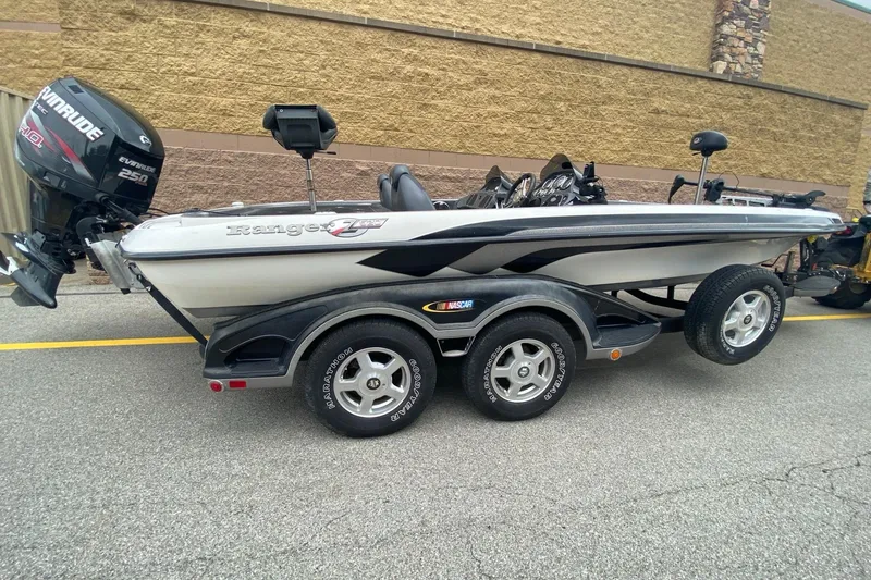 Slide: The Image of 2009 Ranger Z520 Comanche boat with Evinrude 250 engine on trailer. - 1
