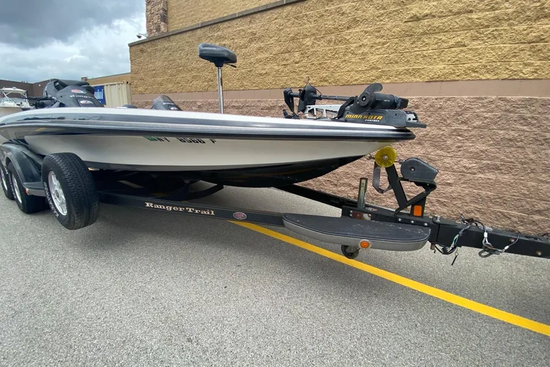 Slide: The Image of 2009 Ranger Z520 Comanche boat on trailer, parked outdoors. - 2