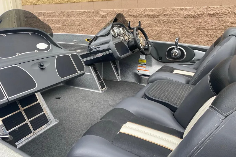 Slide: The Image of 2009 Ranger Z520 Comanche boat interior with steering wheel and seating. - 5