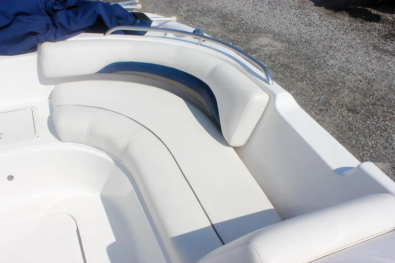 Slide: The Image of 2013 Hurricane SunDeck Sport 188 OB boat with white cushioned seating. - 15