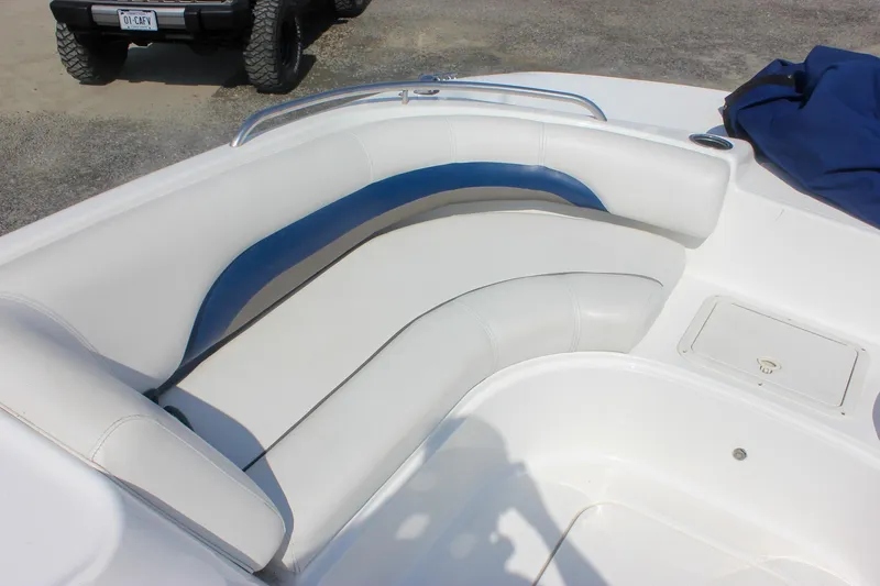Slide: The Image of 2013 Hurricane SunDeck Sport 188 OB boat interior with white and blue seating. - 16