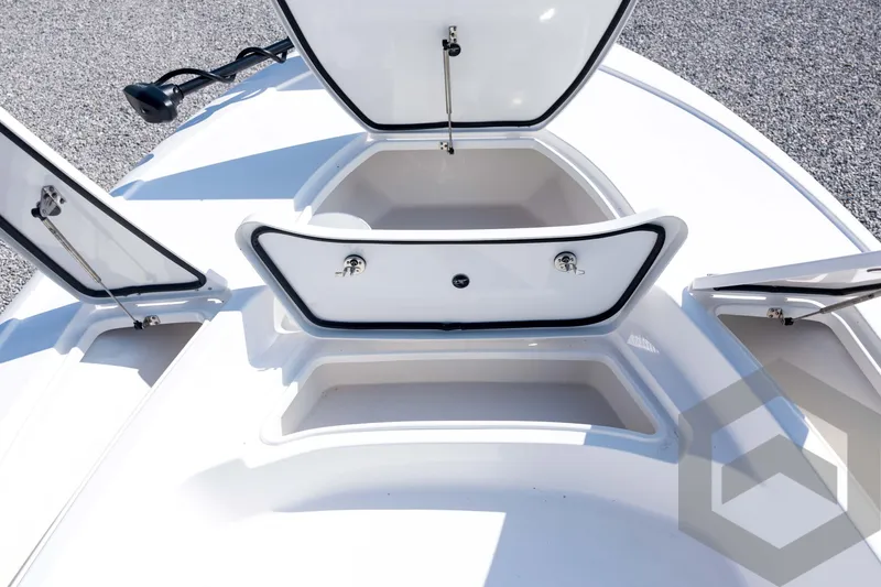 Slide: The Image of Open storage compartments on a 2026 Tidewater 2410 Bay Max boat deck. - 13