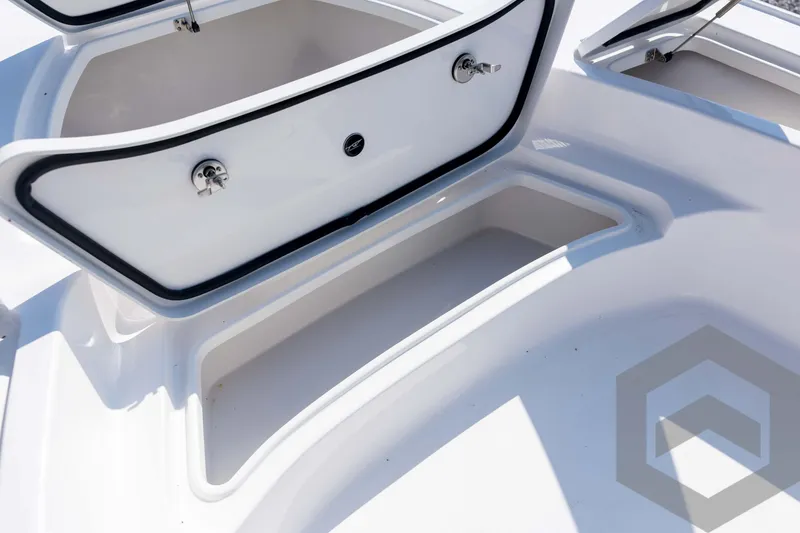 Slide: The Image of Open storage compartments on 2026 Tidewater 2410 Bay Max boat, showcasing ample space. - 15