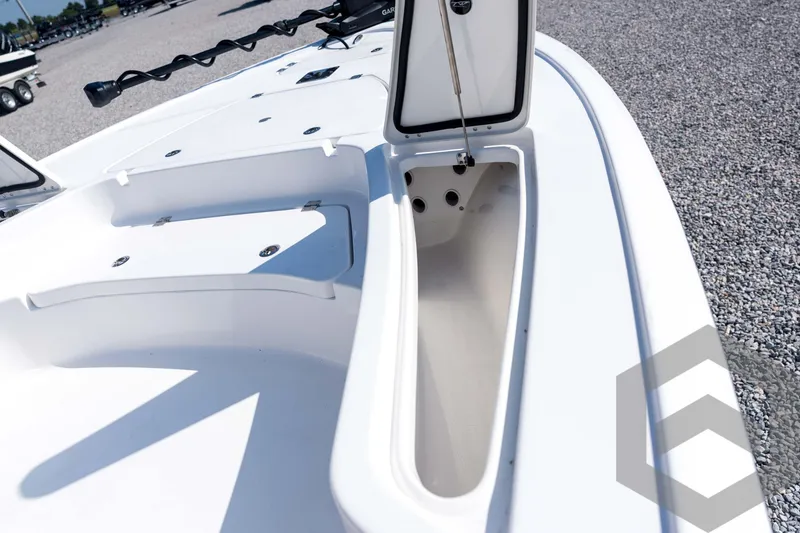 Slide: The Image of 2026 Tidewater 2410 Bay Max boat with open storage compartment on deck. - 17