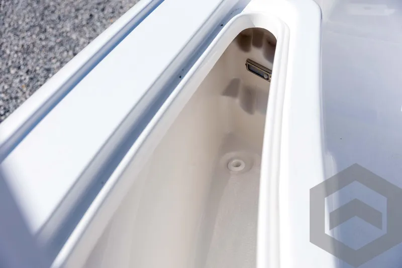 Slide: The Image of Storage compartment of 2026 Tidewater 2410 Bay Max boat, white interior. - 18