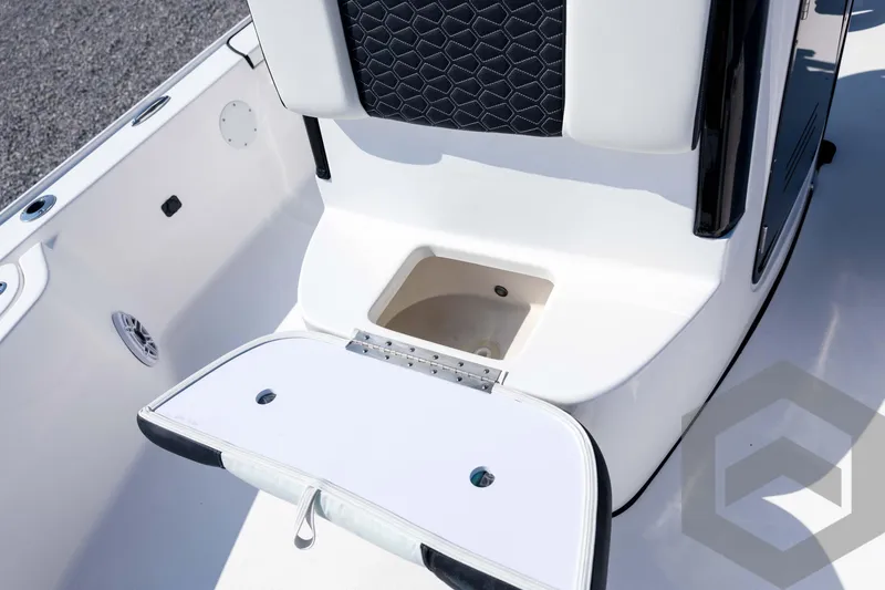 Slide: The Image of 2026 Tidewater 2410 Bay Max boat interior with open storage compartment. - 22
