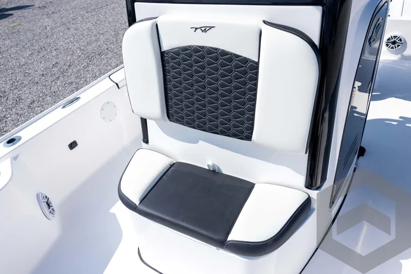 Slide: The Image of 2026 Tidewater 2410 Bay Max boat seat with black and white cushioned design. - 23