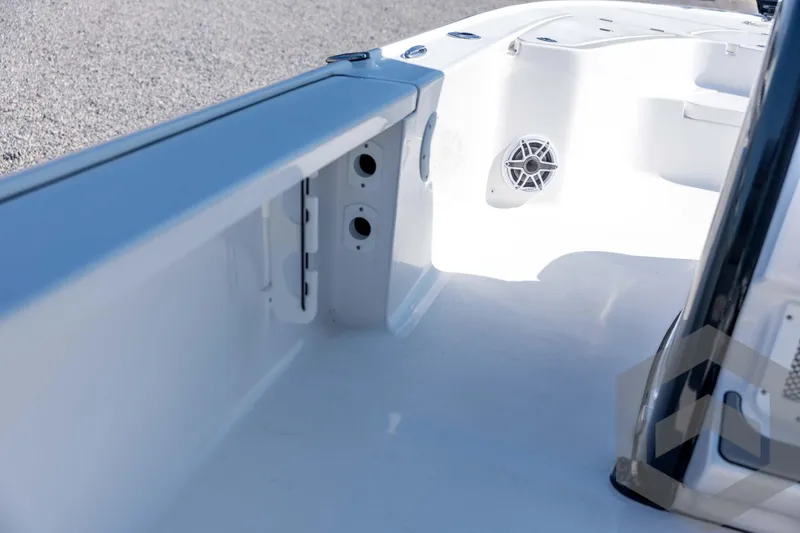 Slide: The Image of 2026 Tidewater 2410 Bay Max boat interior with speaker and storage compartments. - 24